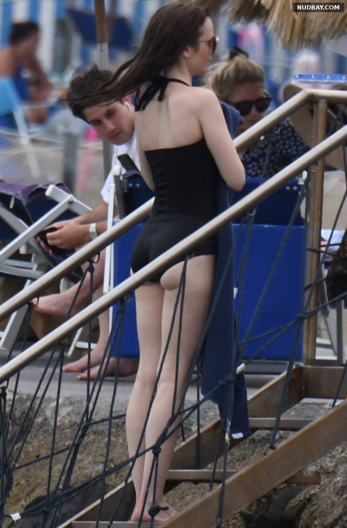 Lily Collins Ass in black swimsuit at the Isabella hotel in Ischia