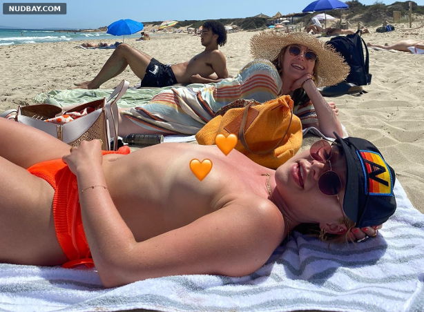 Florence Pugh Topless sunbathing on the beach May 23 2022 01