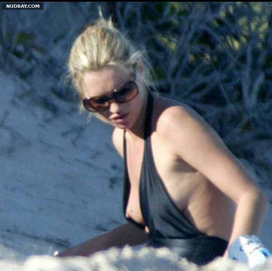 Kate Moss nipple flashing on the beach 2006