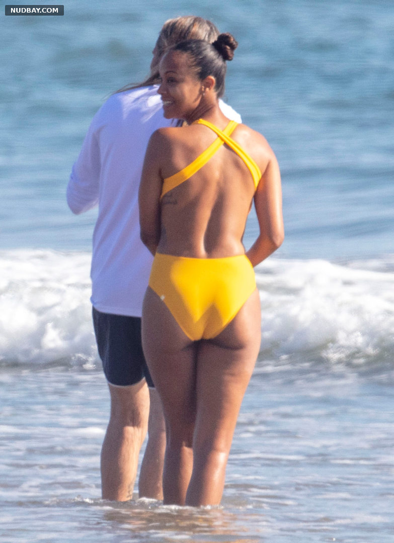 Zoe Saldana nude butt wears yellow swimsuit in Malibu California 2020