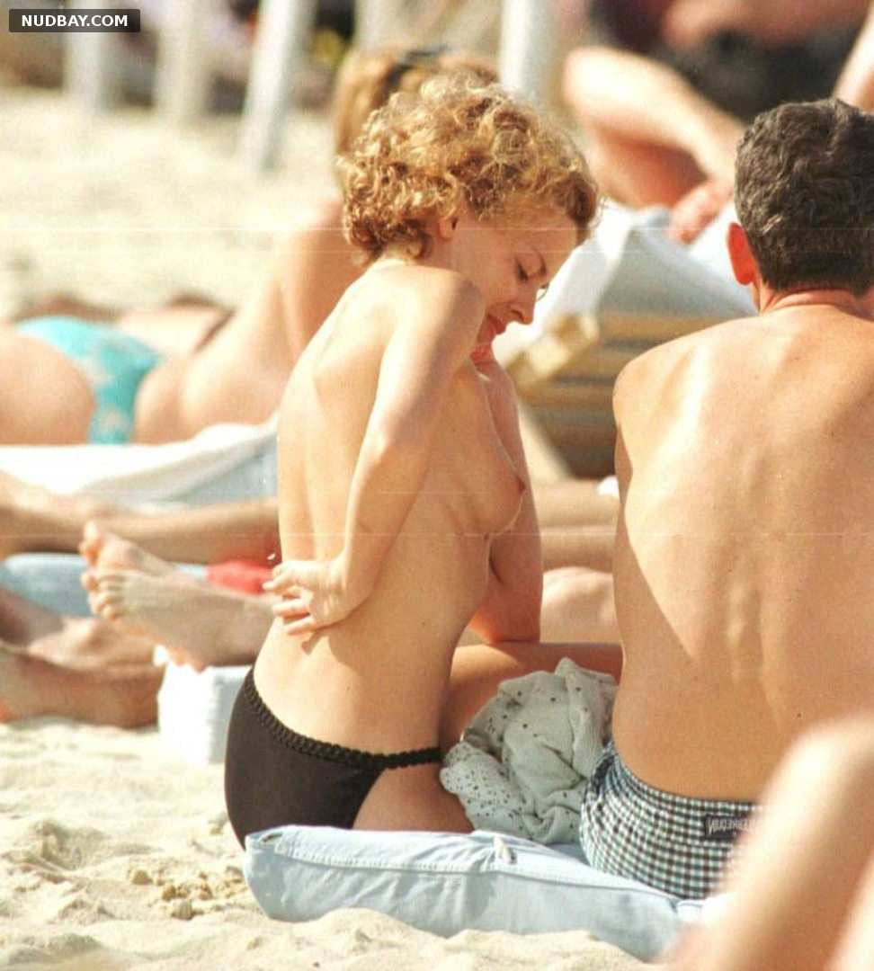 Kylie Minogue naked boobs on the beach vacation 1998