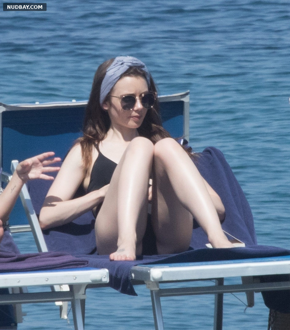 Lily Collins Nude Crotch wearing a black swimsuit at the Hotel Regina Isabella in Ischia 2018