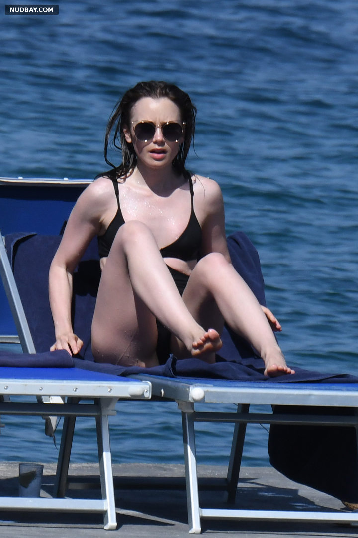 Lily Collins nude pussy sexy wearing a black one piece bathing suit Ischia Porto 2018